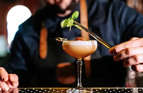 a bartender making a cocktail